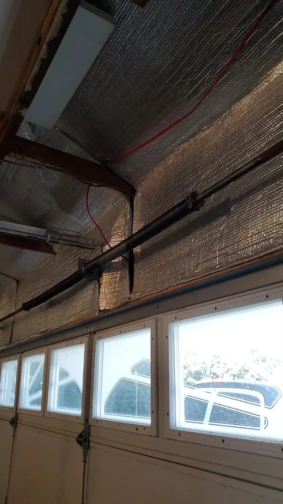 Garage door spring repair in progress